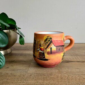 Hand painted large ceramic mug from Peru or Ecuador with village scene.